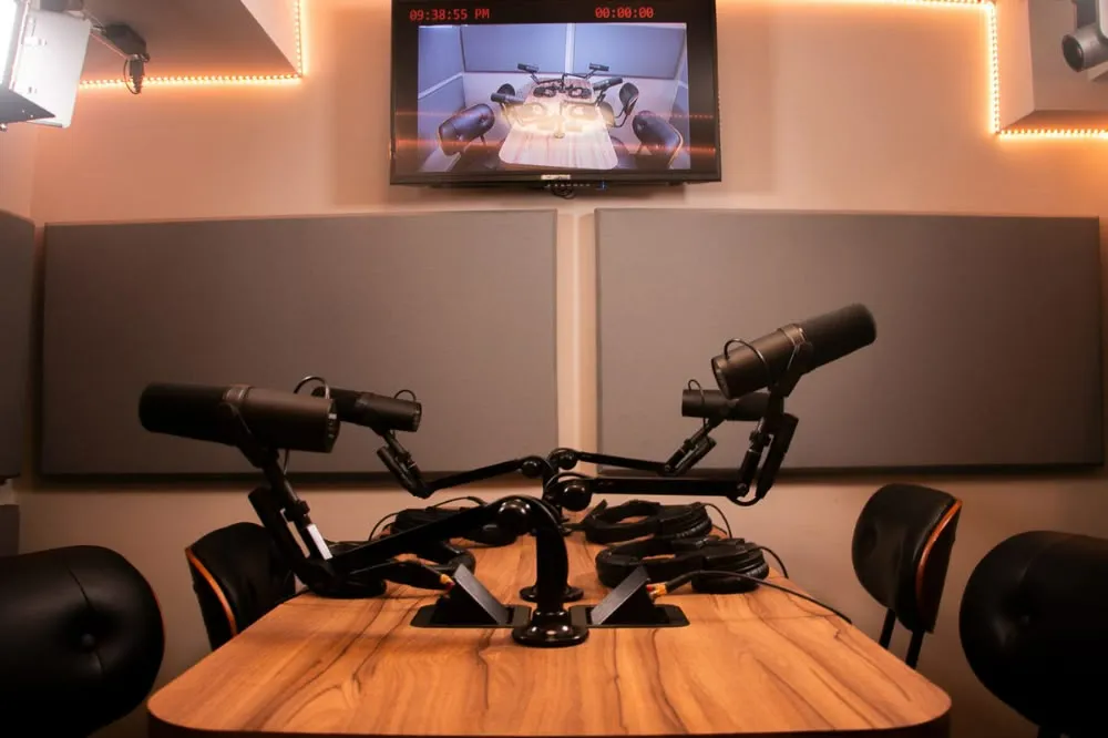 Studio camera on a tripod under controlled magenta and green lighting